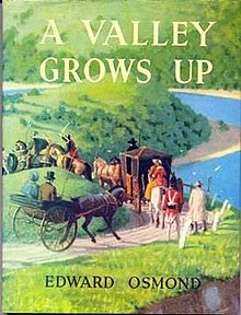 Front cover of a book titled 'A Valley Grows Up'. A full colour watercolour image of a train of carriags and horeback riders following a road down to a valley fills the entire cover.